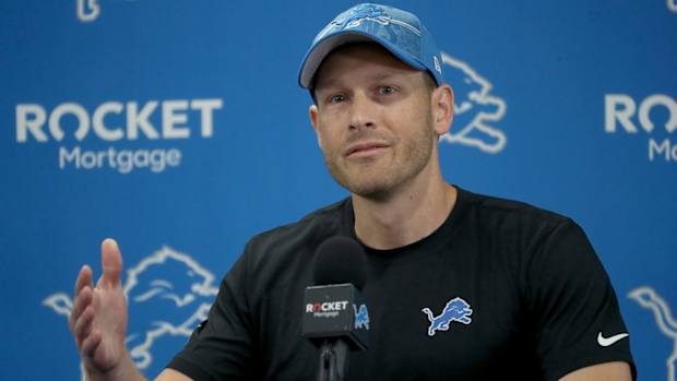 Lions offensive coordinator Ben Johnson talks with reporters before training camp.